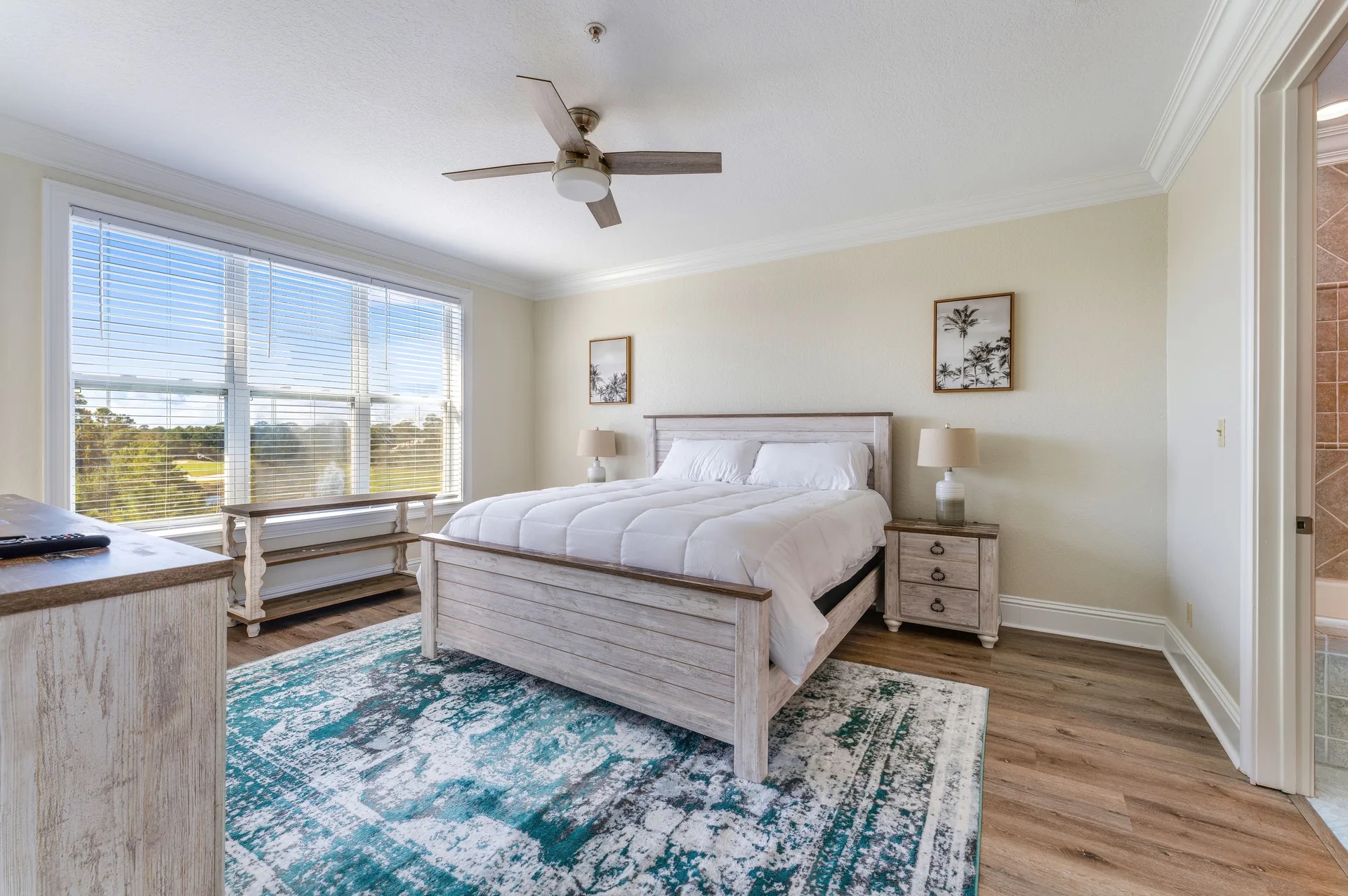 Residence Condominium bedroom with king bed and golf course view