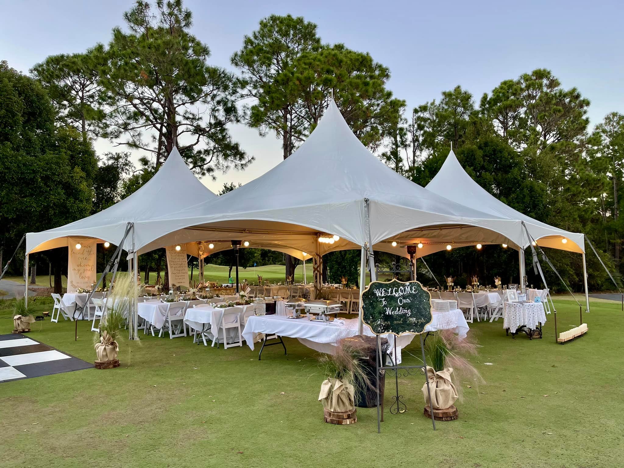 Large arched tent set for an outdoor wedding reception of up to 300 guests at St. James Bay
